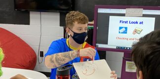 UofL student teaching in a classroom.