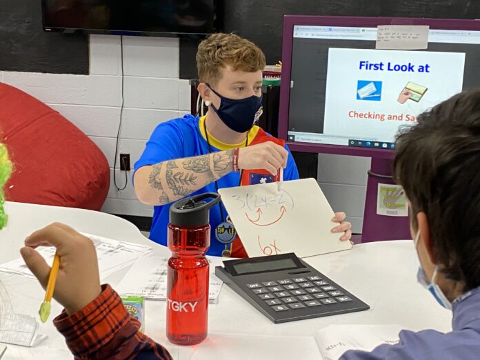 UofL student teaching in a classroom.