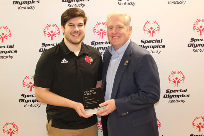 Chitwood_VoloftheYear UofL graduate student and Louisville native Corey Chitwood (left) was recently named volunteer of the year by Special Olympics Kentucky.