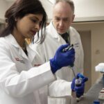 Juhi Bagaitkar, assistant professor, and Richard Lamont, professor and chair of the UofL Department of Oral Immunology and Infectious Disease