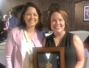 Jennifer Koch, right, receiving the American College of Physicians Laureate Award in 2019