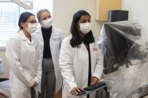 Pallavi Patil consults with UofL dental students.