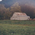 Barn and haybales. Photo by Josh Sorenson from Pexels