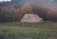 Barn and haybales. Photo by Josh Sorenson from Pexels