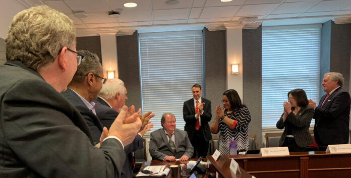 University of Louisville trustees applauded Professor Mark Running for receiving the 2022 Trustees Award.