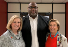 University of Louisville Senior Associate Athletic Director Marvin Mitchell, center, received the 2022 George J. Howe Distinguished Staff Award. Pictured with Mitchell are Interim President Lori Stewart Gonzalez, left, and UofL Board of Trustees Chair Mary Nixon.