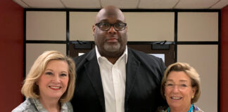 University of Louisville Senior Associate Athletic Director Marvin Mitchell, center, received the 2022 George J. Howe Distinguished Staff Award. Pictured with Mitchell are Interim President Lori Stewart Gonzalez, left, and UofL Board of Trustees Chair Mary Nixon.