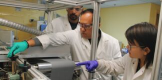 UofL researchers (front to back) Hui Wang, Arjun Thapa and Milinda Bharatha apply a lithium titanate slurry coating to make lithium-ion electrode battery prototypes at UofL’s Conn Center for Renewable Energy Research. The coated anode material is paired with a corresponding cathode sheet to create lithium-ion batteries.