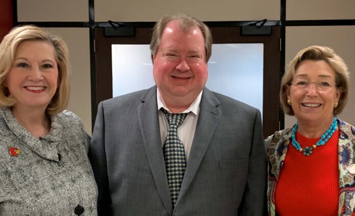 University of Lou8isville Professor Mark Running, center, was awarded the UofL Trustees Award for his ongoing commitment to student development. Rictured with Running are UofL Interim President Lori Stewart Gonzalez, left, and Board of Trustees Chair Mary Nixon.