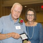 2019 Gold Standard of Optimal Aging Award recipient James Duggins, left, with Anna Faul, executive director of the UofL Trager Institute