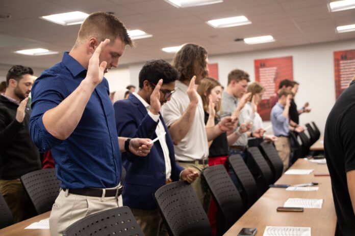 Nearly 100 students, faculty, staff and alums take the oath of the Order of the Engineer at Speed School’s inaugural ring ceremony held April 25, 2022.
