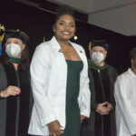 Members of the School of Medicine Class of 2026 receive their white coats