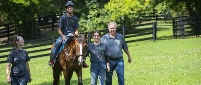 Eric Wright and family with an equine therapy partner at Cope's Hope