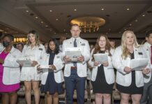 Medical students in the class of 2026 recite the Declaration of Geneva at the 2022 White Coat Ceremony
