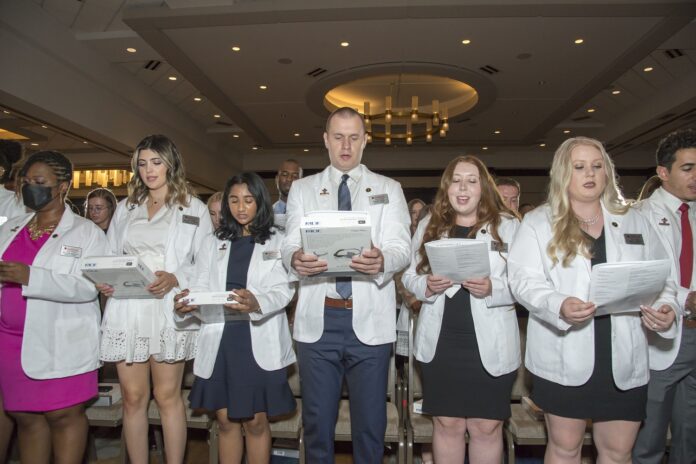 Medical students in the class of 2026 recite the Declaration of Geneva at the 2022 White Coat Ceremony