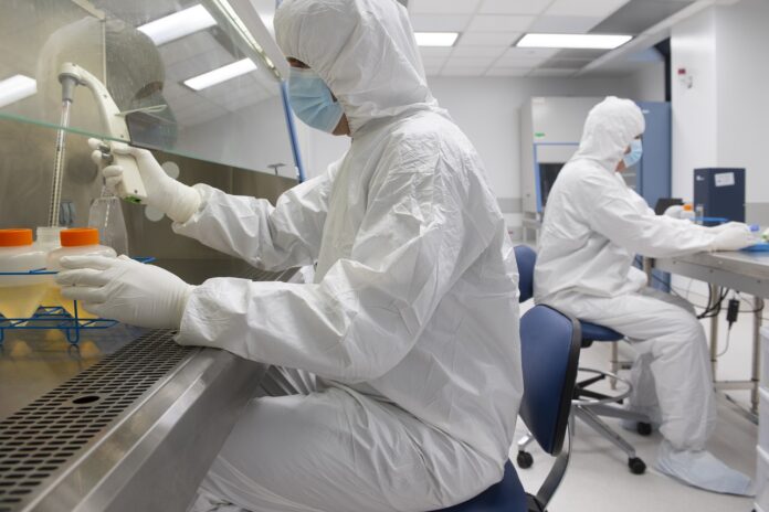 Facility team in the of the UofL Health - Brown Cancer Center GMP Manufacturing Facility at the University of Louisville.