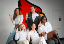 The initial students involved in The Bird's Nest, with director Karen Freberg (center).