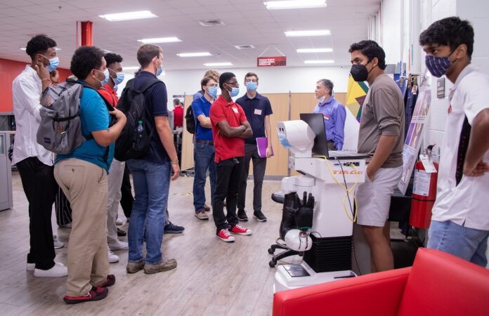 The robot Tiago is introduced to students at UofL’s Louisville Automation and Robotics Research Institute, known as LARRI. LARRI and two other facilities at UofL will use new federal funding to procure additional robotic technology and introduce that technology to students, trainees and workers.