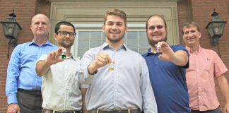 SoFab Inks LLC, a startup consisting of University of Louisville graduate students and mentored by UofL faculty members, is a finalist in the U.S. Department of Energy’s American-Made Perovskite Startup Prize. From left, Craig Grapperhaus, professor of chemistry, graduate students Sashil Chapagain, Blake Martin and Peter Armstrong and Thad Druffel, research theme leader. Photo by Andrew Marsh.
