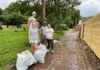 Rebecca Turney (UofL student), Finley Barber (Duke student), Jody Dahmer (BGT), and Eileen Sember (UofL student) work to clean up the Oak Street alley.