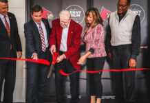 Denny Crum Hall officially opened with a ceremony featuring the legendary coach cutting the ribbon.