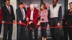 Denny Crum Hall officially opened with a ceremony featuring the legendary coach cutting the ribbon.