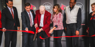 Denny Crum Hall officially opened with a ceremony featuring the legendary coach cutting the ribbon.