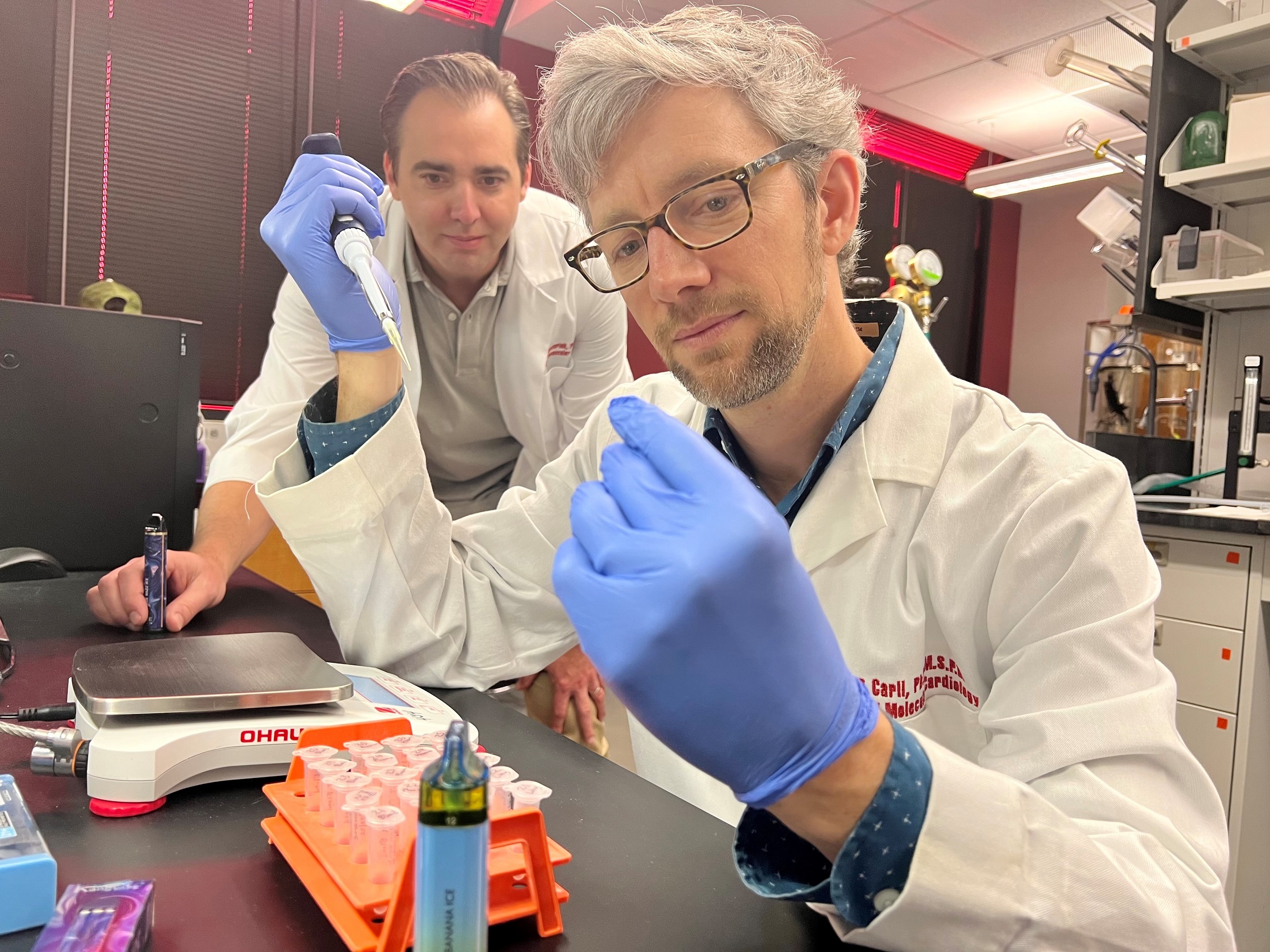 Alex Carll, assistant professor in the UofL Department of Physiology, front, with Matthew Nystoriak, associate professor of medicine