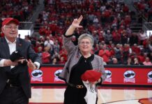 Kim Schatzel and husband Trevor Iles are introduced at KFC Yum! Center during a Louisville Cardinals women's basketball game.