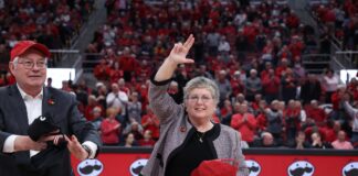 Kim Schatzel and husband Trevor Iles are introduced at KFC Yum! Center during a Louisville Cardinals women's basketball game.