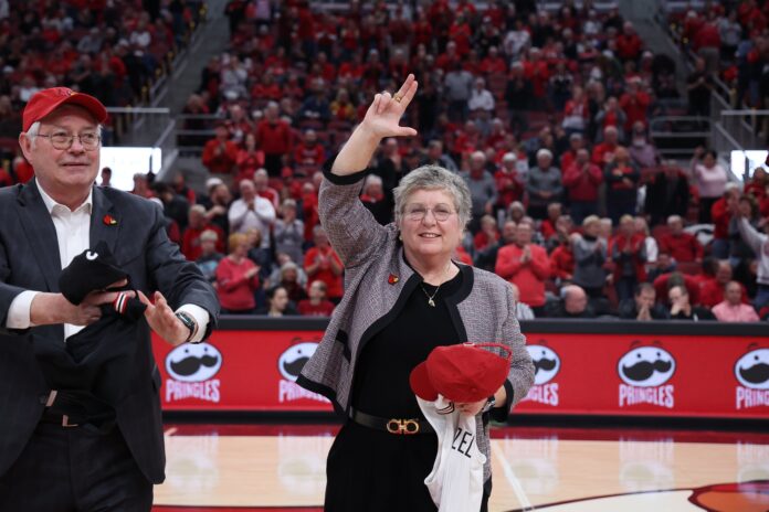 Kim Schatzel and husband Trevor Iles are introduced at KFC Yum! Center during a Louisville Cardinals women's basketball game. In November, Schatzel was named UofL's 19th president.