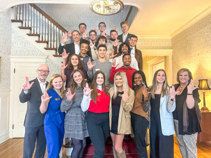 SGA leadership and executive staff with UofL's interim provost and interim president.