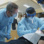 Wil Abshier, left, assistant professor of comprehensive dentistry at the University of Louisville School of Dentistry, is a recent graduate of UofL’s new Master of Science in Health Professions Education program.