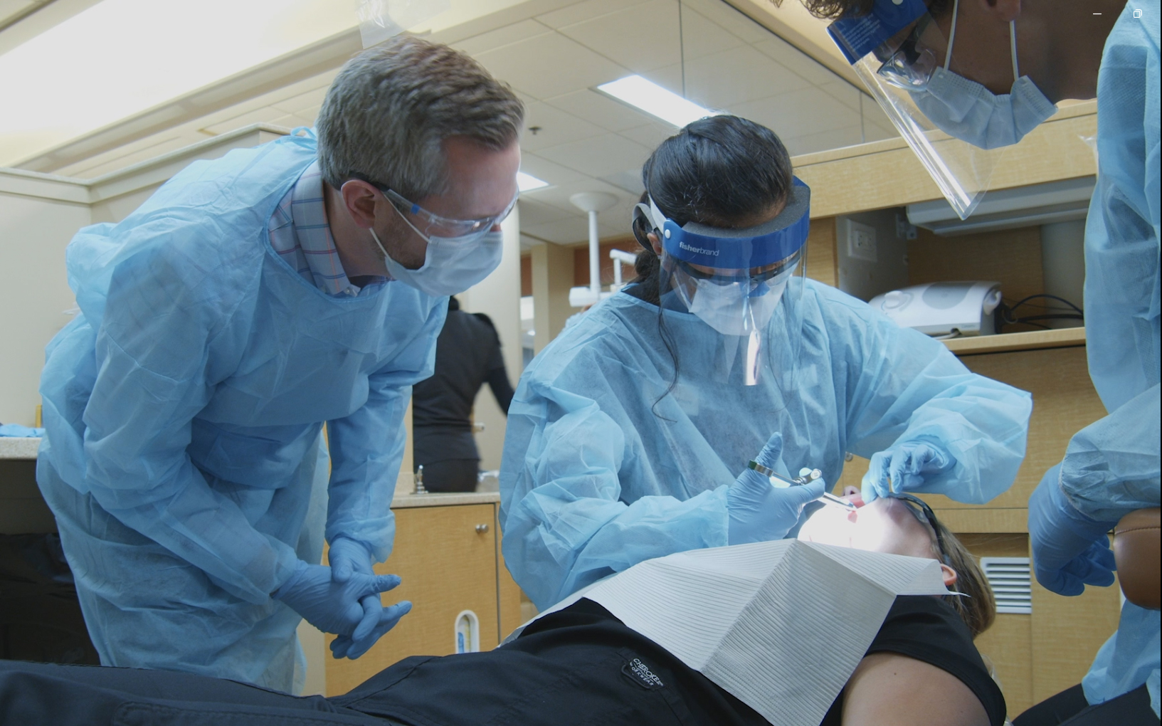 Wil Abshier, left, assistant professor of comprehensive dentistry at the University of Louisville School of Dentistry, is a recent graduate of UofL’s new Master of Science in Health Professions Education program.