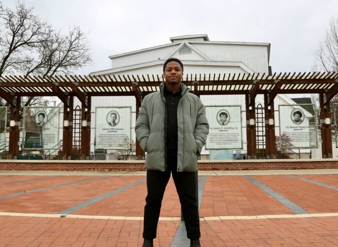 UofL SGA President Dorian Brown stands in Freedom Park.