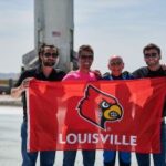 Speed School alumni and Blue Origin employees Nick Greco, Gregg Blincoe and Matt Cosgrove welcome Speed School supporter Clinton Kelly back to earth after his flight aboard New Shepard.