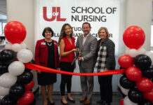 UofL and ScionHealth officials at the ribbon cutting for the School of Nursing Student Collaboration Center.