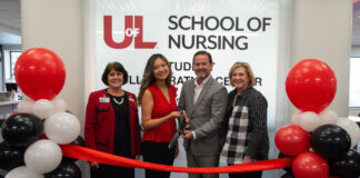 UofL and ScionHealth officials at the ribbon cutting for the School of Nursing Student Collaboration Center.