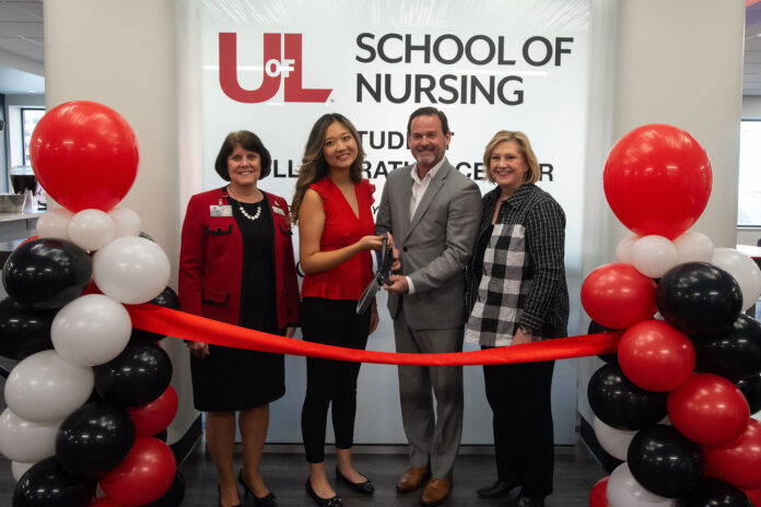 UofL and ScionHealth officials at the ribbon cutting for the School of Nursing Student Collaboration Center.
