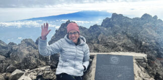 Laura Dixon at the summit of Mount Meru in Tanzania in February 2022. Dixon will tackle Mount Kilimanjaro in March.