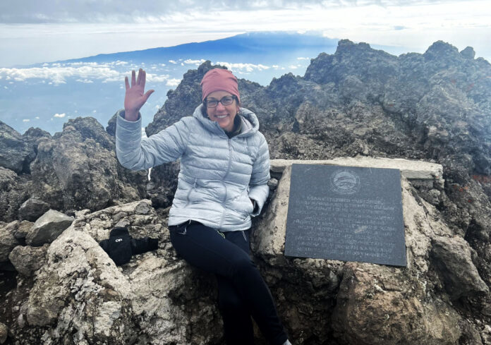 Laura Dixon at the summit of Mount Meru in Tanzania in February 2022. Dixon will tackle Mount Kilimanjaro in March.