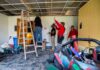 4 men doing construction inside Brodschi Hall