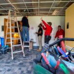 4 men doing construction inside Brodschi Hall