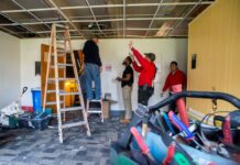 4 men doing construction inside Brodschi Hall