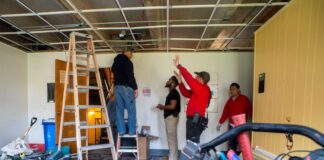 4 men doing construction inside Brodschi Hall