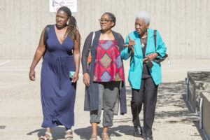 In 2022, Delores Gordon Alleyne visited the UofL School of Medicine with her daughters, Valerie Alleyne Udeozor, left and Dr. Rebecca Alleyne, and met with Dean Toni Ganzel, faculty, staff and medical students.