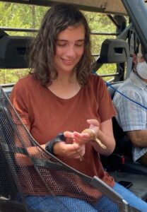 Autumn Magnuson holds a snake during a field study. 