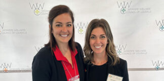 Kristina Doan (left), communications manager for UofL's Office of Human Resources, and Tamara Iacono, wellness coordinator for UofL's Get Healthy Now program, accepted the Silver Worksite Wellness Award on behalf of UofL at the Worksite Wellness Council of Louisville’s annual conference May 24.