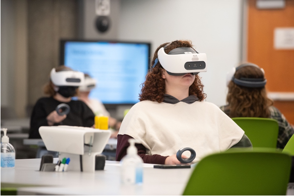 Student uses virtual reality technology for immersive learning.