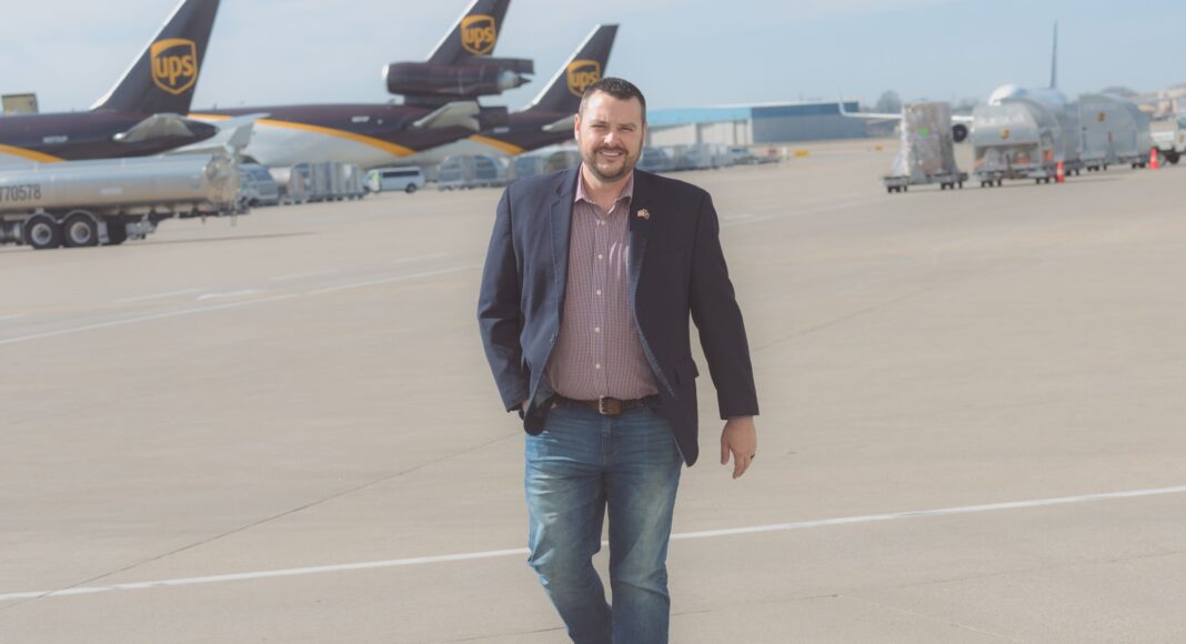 Jeff Wafford walking on runway between UPS planes